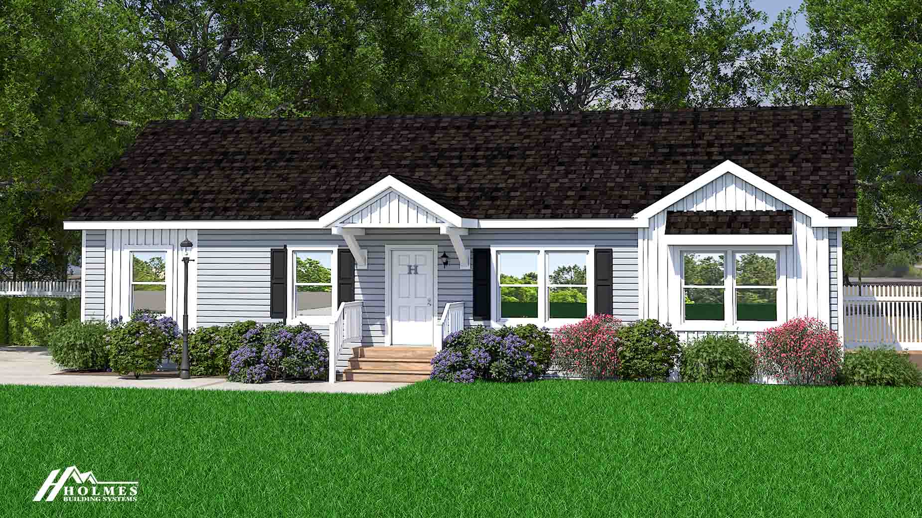 A single-story modular home with a white exterior, dark roof, front porch, large windows, and landscaped bushes and flowers.